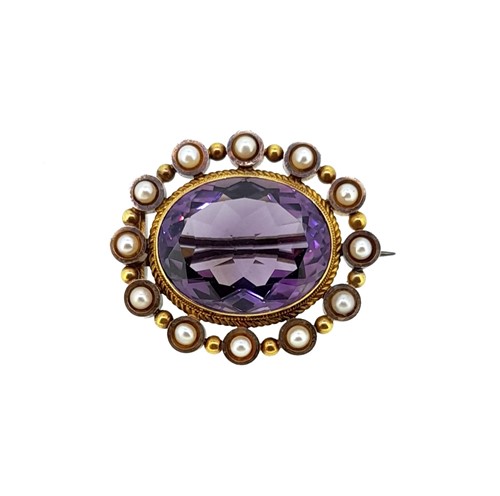 Lot 102 - An amethyst and split pearl brooch