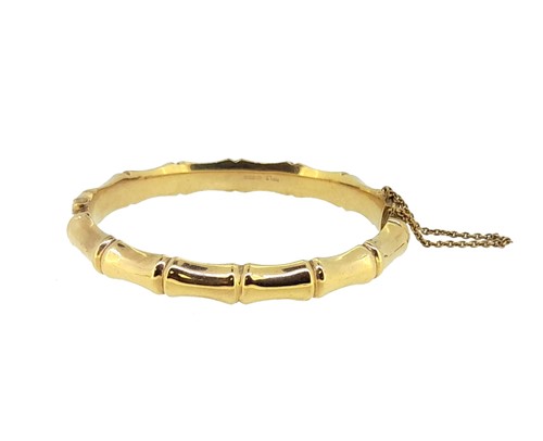 Lot 126 - A 9ct gold bamboo style hinged bangle