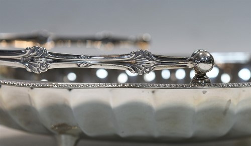 Lot 626 - An Edward VII silver swing handled bread basket