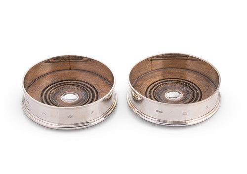 Lot 676 - A pair of late 20th century silver bottle coasters