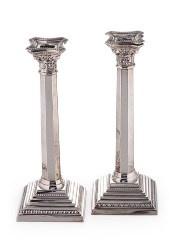 Lot 673 - A pair of mid 20th century silver candlesticks