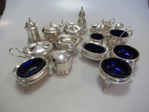 Lot 220 - 4 sets of three piece silver cruets, together...