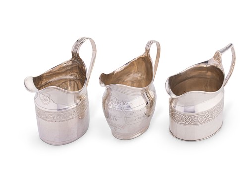Lot 551 - A trio of George III silver cream jugs