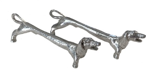 Lot 444 - A pair of late 20th century cast silver novelty knife rests