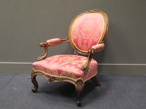Lot 442 - A Victorian carved frame spoonback armchair