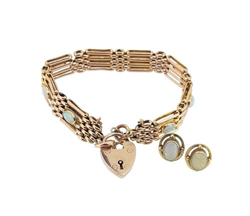Lot 123 - An opal set gate bracelet and a pair of opal ear studs
