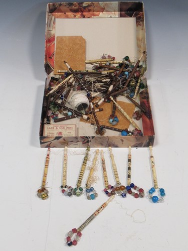 Lot 41 - A collection of bone and wooden lace bobbins,...