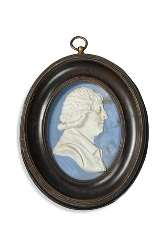 Lot 312 - A Wedgwood blue jasperware oval portrait plaque