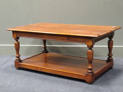 Lot 430 - A polished mahogany coffee table with lower...
