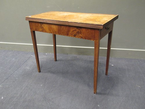 Lot 398 - A 19th century mahogany foldover tea table, 73...