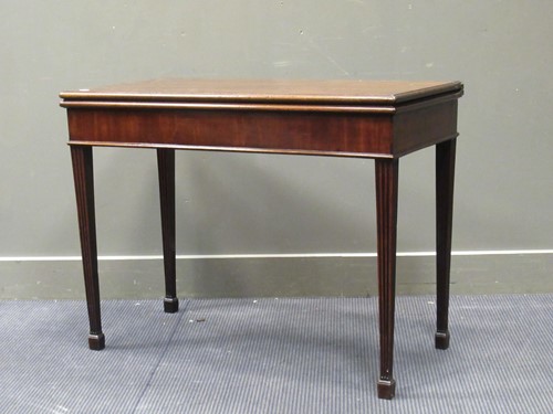 Lot 515 - A 19th century mahogany foldover tea table, 74...