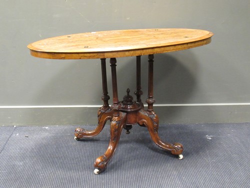 Lot 461 - A Victorian walnut loo table with carved...