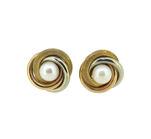 Lot 209 - A pair of pearl knot style ear clips