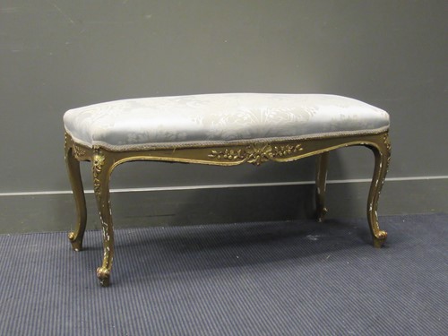 Lot 419 - A Louis XV style gilt rectangular stool with...