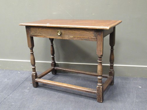 Lot 557 - An 20th century oak side table with single...