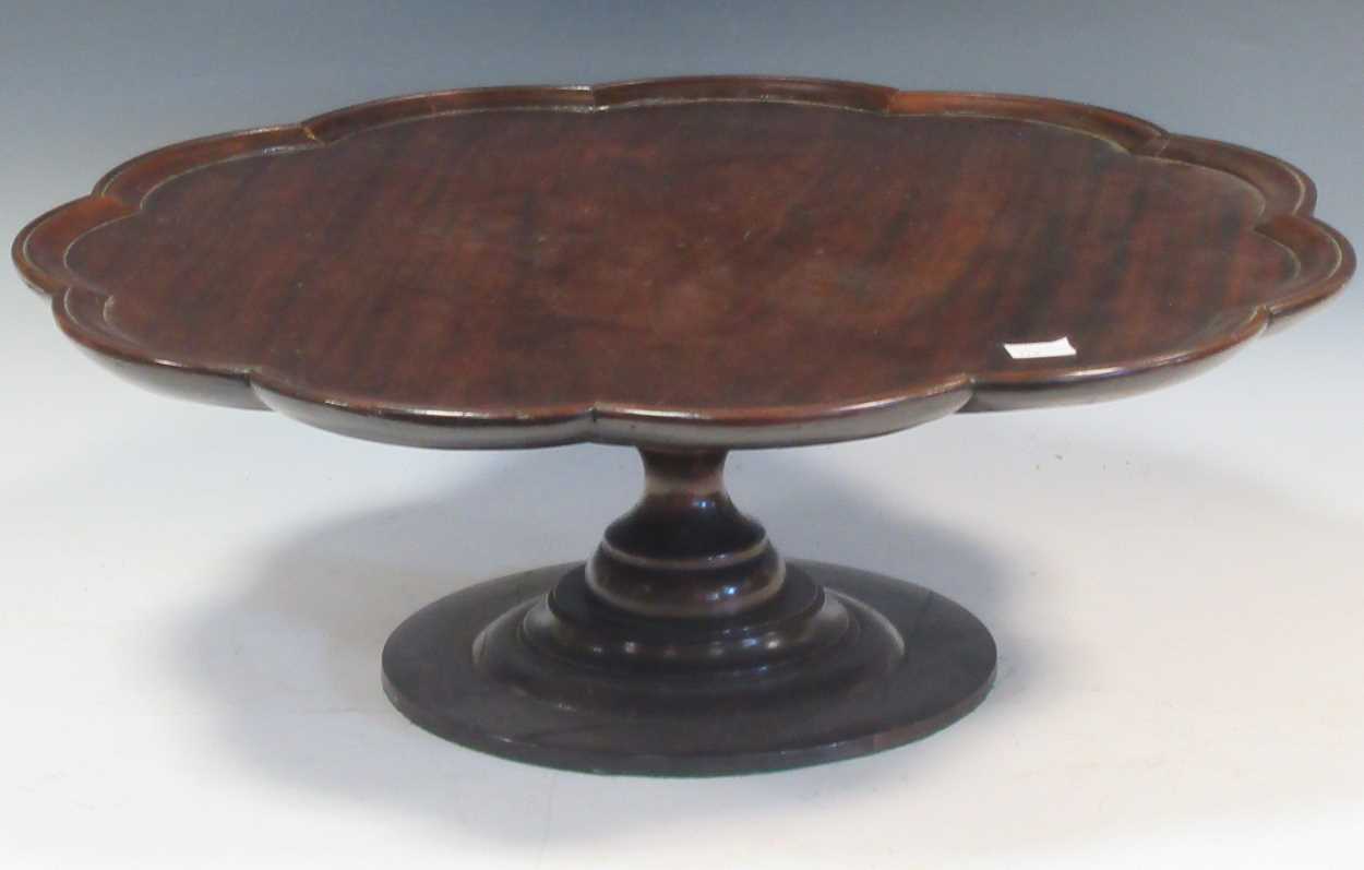 Lot 582 - A mahogany revolving lazy susan, 18cm high and...