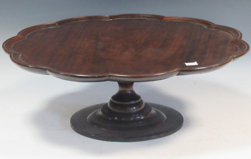 Lot 582 - A mahogany revolving lazy susan, 18cm high and...