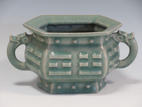 Lot 36 - A celadon twin handled censor with chilong...