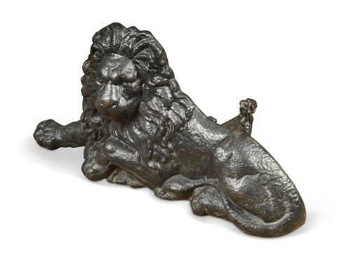 Lot 417 - A cast iron boot scraper in the form of a lion, 19th century