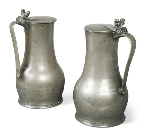 Lot 137 - A near pair of John de St Croix Jersey pewter lidded measures,  mid 18th century