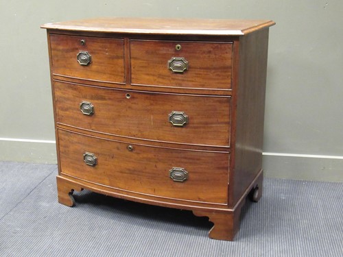 Lot 436 - A 19th century mahogany bow front chest of two...