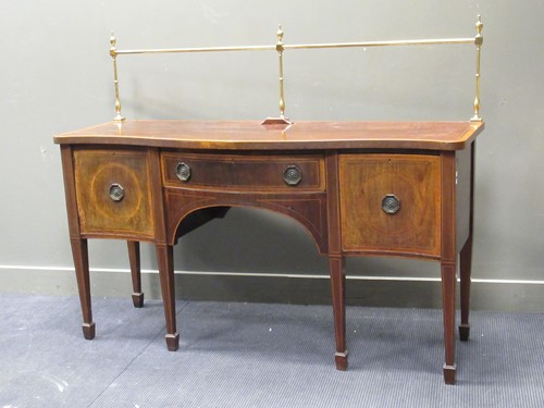 Lot 409 - A 19th century mahogany serpentine sideboard,...