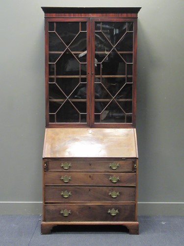 Lot 319 - A George III and later mahogany bureau...