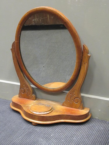 Lot 470 - A late Victorian mahogany oval swing mirror,...