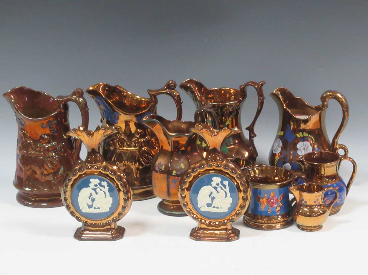 Luster Items Lot 18 - A collection of lustre to include jugs, cans