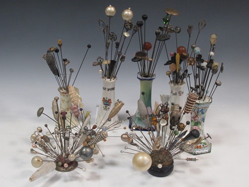 Lot 9 - A collection of hat pins of varying sizes