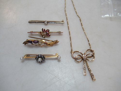 Lot 249 - a diamond and pearl cluster bar brooch tested...