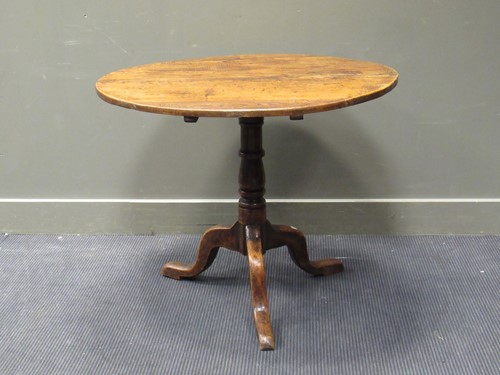 Lot 435 - An elm topped circular tripod table, 19th...