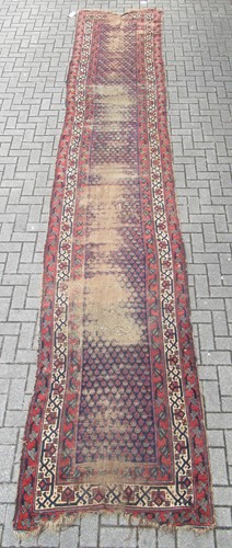 Lot 603 - A 19ft hand-knotted caucasian runner, circa 1920
