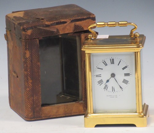 Lot 136 - A brass cased carriage clock, the enamel dial...