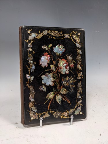 Lot 338 - An American papier mache covered album of...