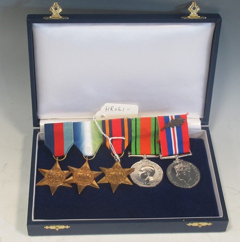 Lot 143 - A WW2 group of 5 re-issue medals, named to...