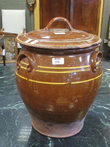 Lot 210 - Slipware pot with lid decorated with yellow...