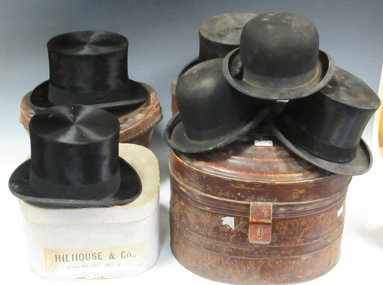 Lot 177 - A collection of four black felt top hats,
