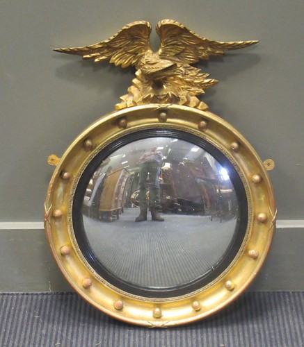 Lot 525 - A Regency style giltwood convex mirror...