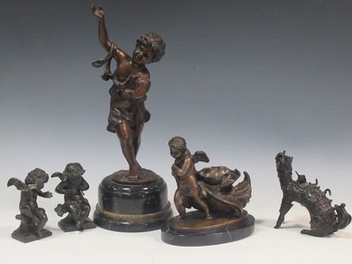 Lot 129 - An early 20th century bronze model of a cherub...