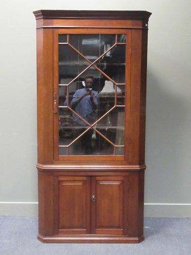 Lot 452 - A Georgian style mahogany barrel back corner...
