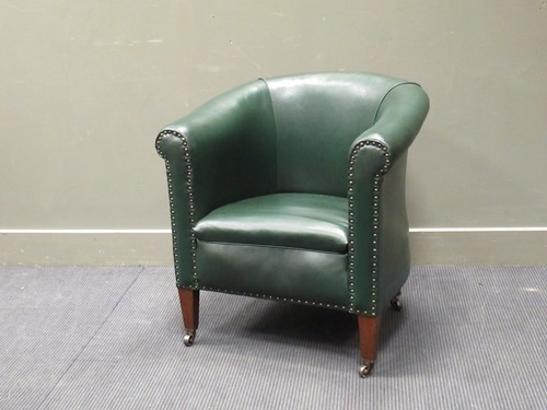 Lot 527 - An Edwardian mahogany club armchair with brass...