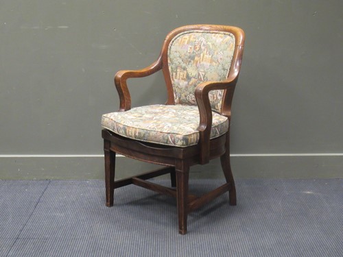 Lot 570 - An Edwardian oak desk chair with tapestry...