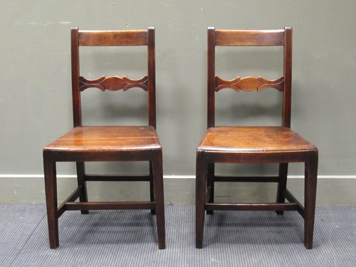 Lot 455 - A pair of early 19th century fruit wood chairs...