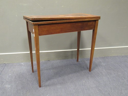 Lot 406 - A George III mahogany card table with fan...