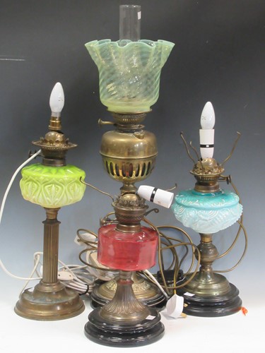 Lot 30 - A collection of oil lamps, some converted for...