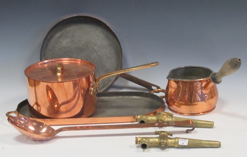 Lot 180 - A collection of coppered metal pans and...