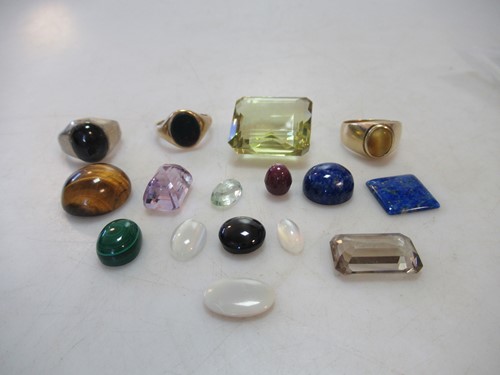 Lot 244 - A group of gemstones, together with a...