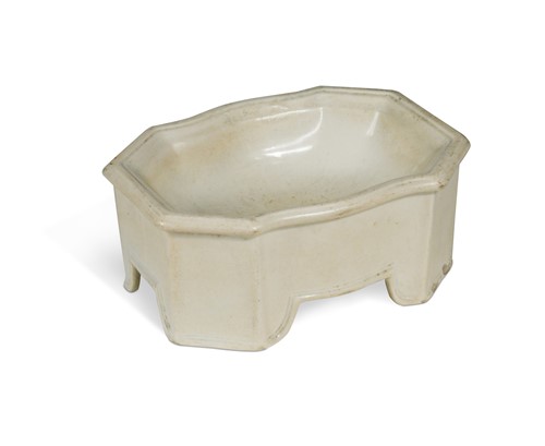 Lot 129 - A rare creamware dog's bowl, circa 1810