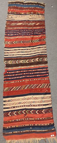 Lot 490 - A kilim runner, early 20th century, 340 x 97cm